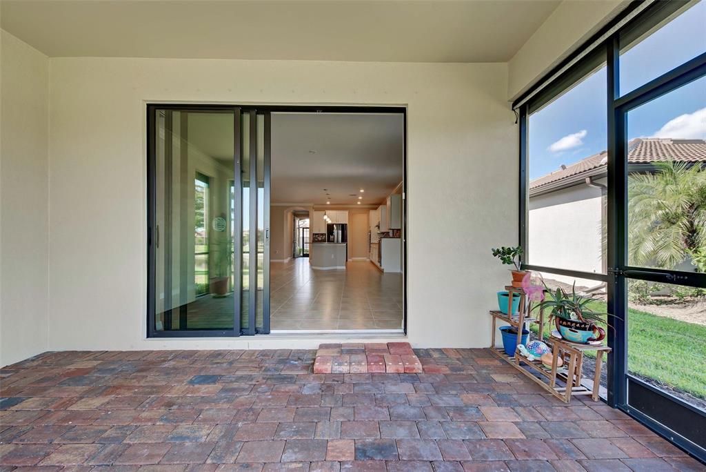 Step out to the screened lanai with pavers and enjoy the weather and the view.  There is room for a table and chairs if you enjoy al fresco dining.