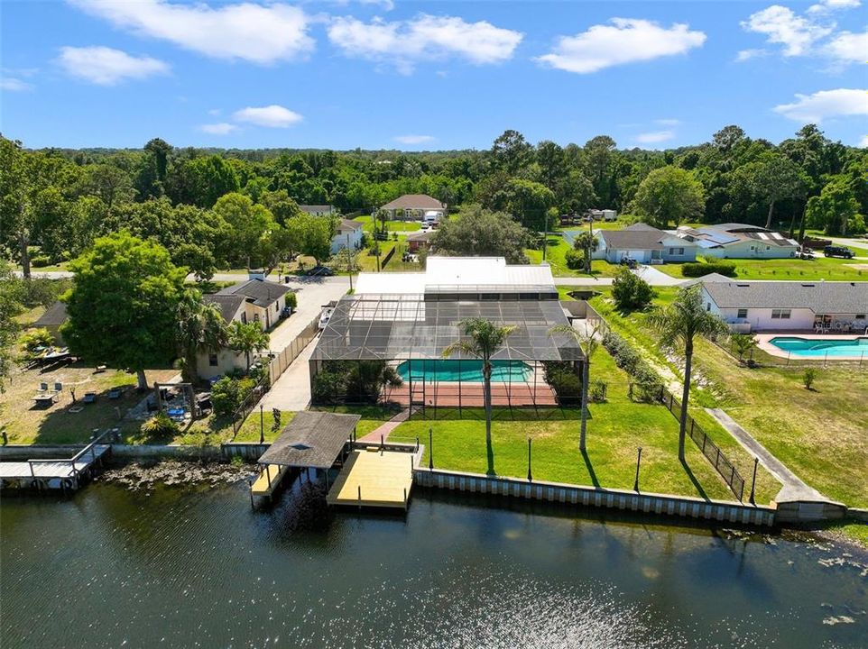 The oversized/extended driveway allows you to PARK YOUR BOAT behind the gate and take full advantage of your private dock/boat house and the direct access to SKI-ABLE LAKE BRANTLEY.