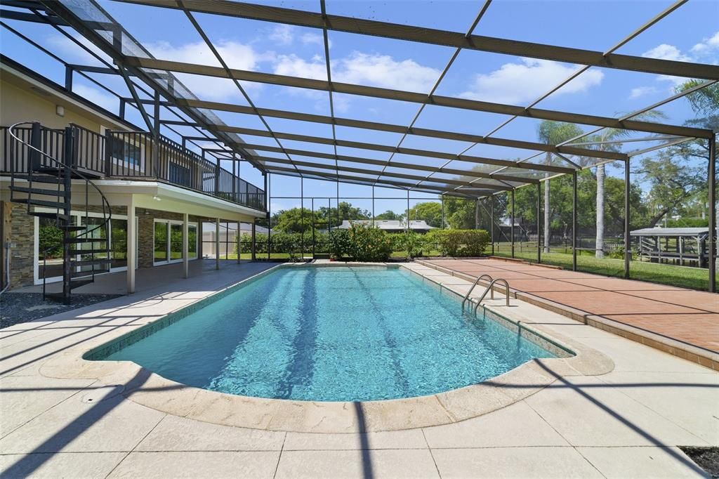 The pool is screened for maximum comfort and the lanai is the perfect spot to relax poolside.