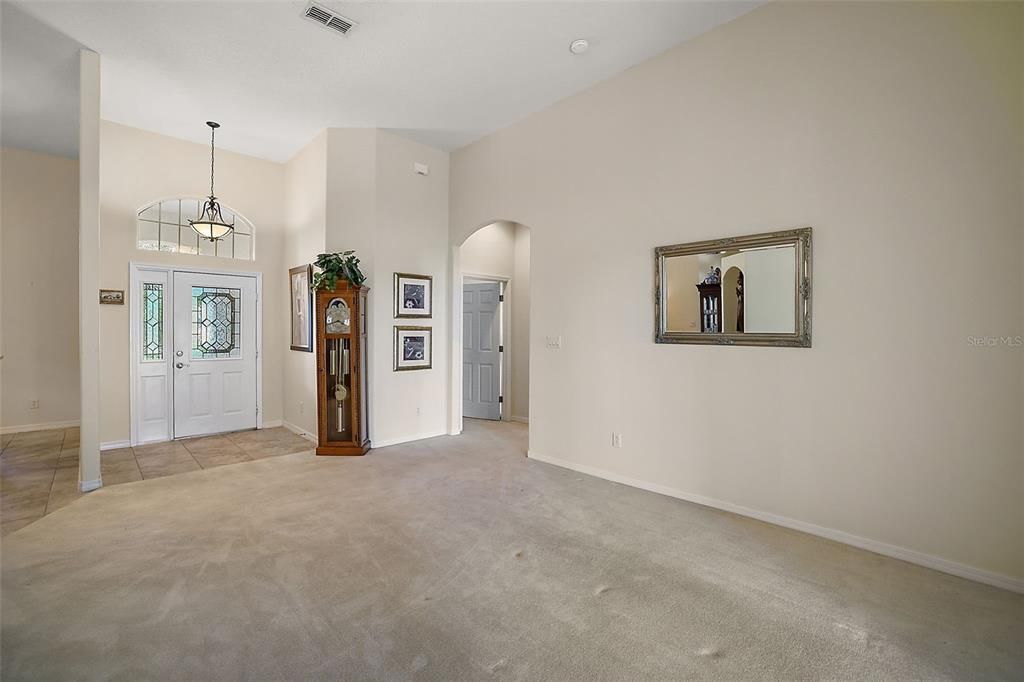 Living Room has Sliders leading to the Screened Lanai, with views of the Golf Course.