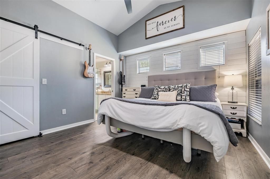 Updated master bedroom with barn door accent