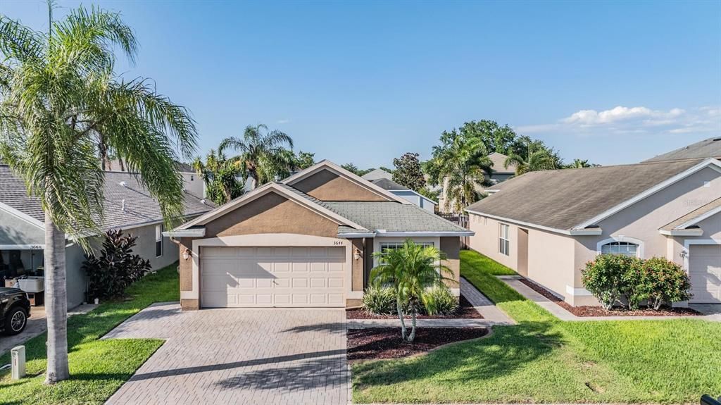 Curb appeal shows off the pavered driveway