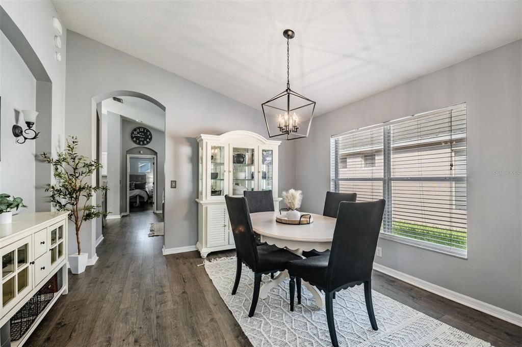 Thoughtful dining room layout with large picture window