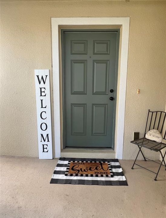 This front porch can accommodate a few rocking chairs and even a table.