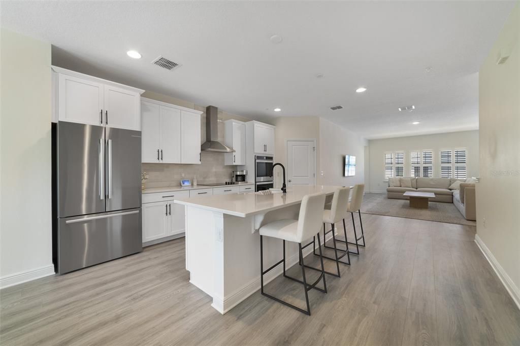 Head up the stairs and into the wide open kitchen, living and dining, windows at both ends let the NATURAL LIGHT pour in and brighten up the space.