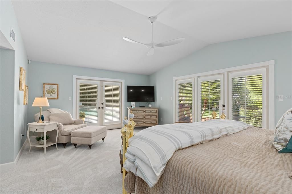 Primary Bedroom with French Doors to Pool Area and a Private Terrace