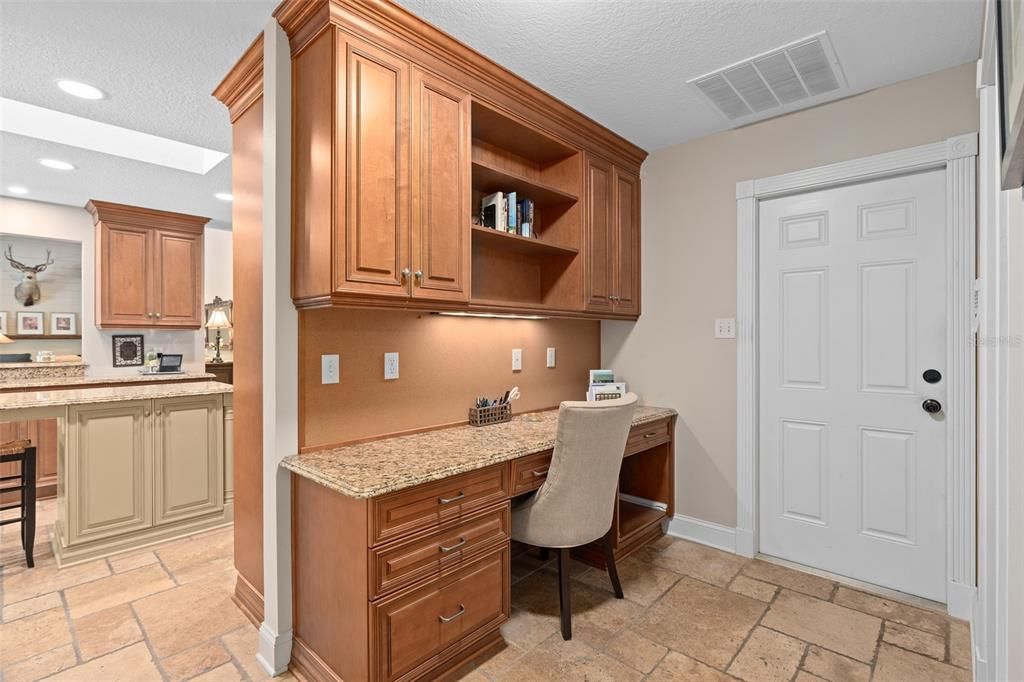 Private work station with desk and custom cabinetry