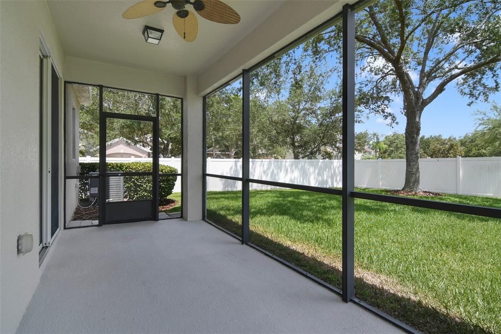 The SCREENED LANAI is the perfect spot to cookout or relax with your favorite beverage overlooking the fenced backyard for added privacy.