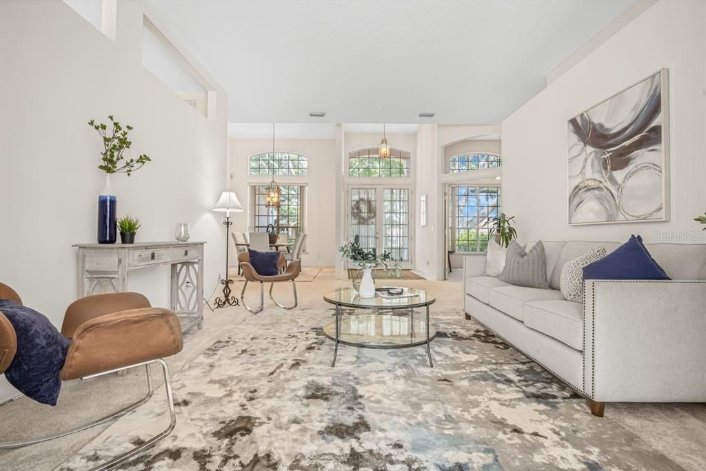 View of formal living room from pool to front door