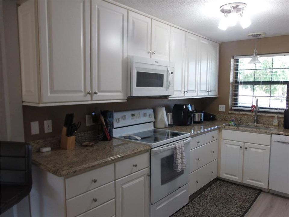 KITCHEN AREA WITH OWNERS ITEMS  HOME IS VACANT