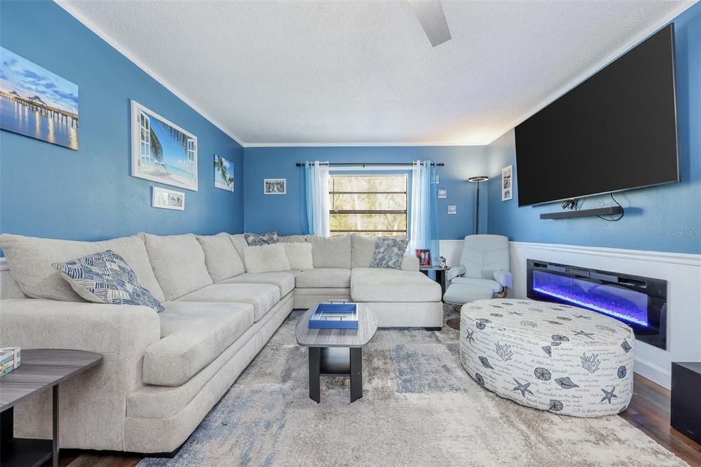 Living room with hardwood / wood-style floors