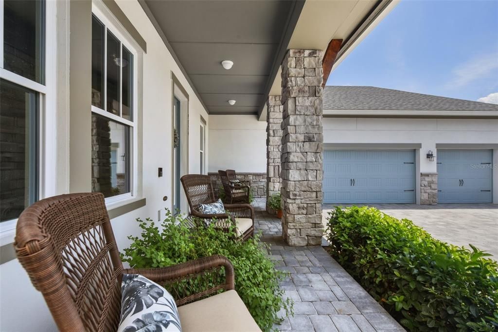 The immaculate landscaping, covered front porch, stacked stone accents and use of metal and shingle roofing all create the ‘castaway’ vibe and welcome you home.