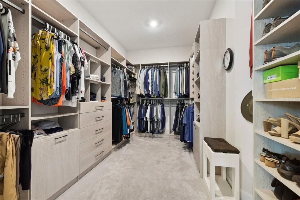 WALK-IN CLOSET w/ CUSTOM CLOSET SYSTEM.