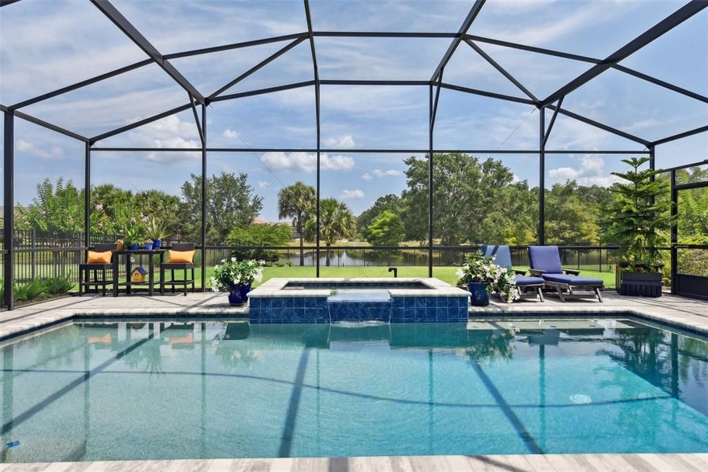 The heated pool & spa has water views!