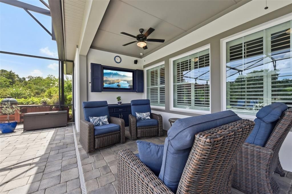 Spending a day at home never felt so good with a private backyard oasis that includes a screened lanai with a custom TV storage and your heated pool and spa all overlooking a lush fenced yard with an 8x10 red cedar pergola to enjoy the water views.