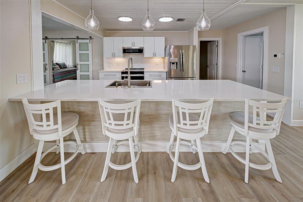 Wide quartz bar area. The heart of the home