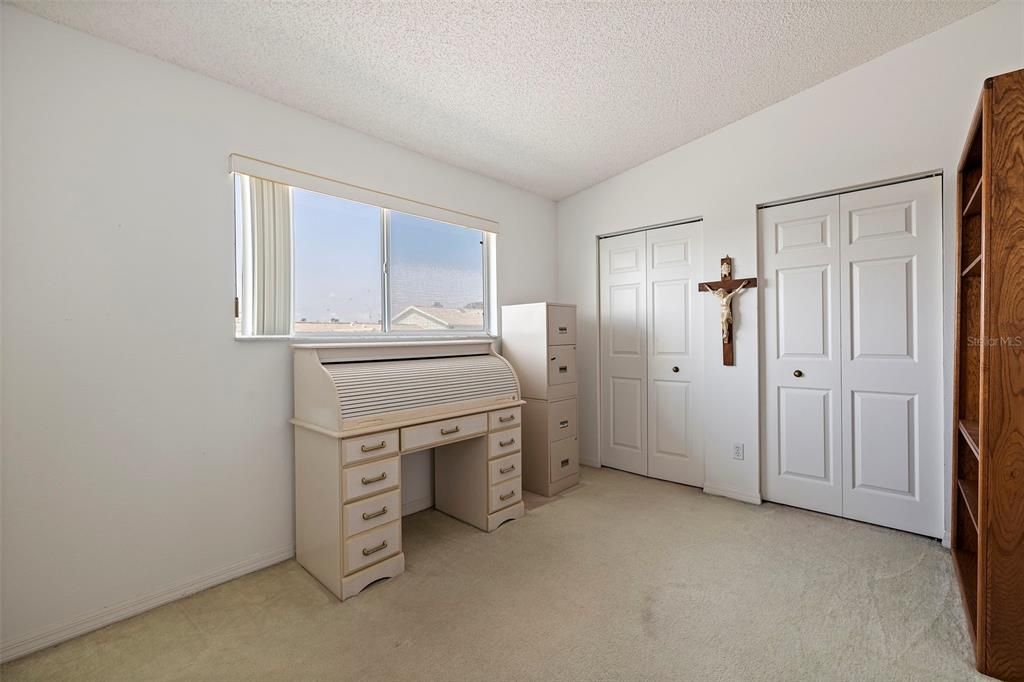 Front, third bedroom, with a wall of closet space.