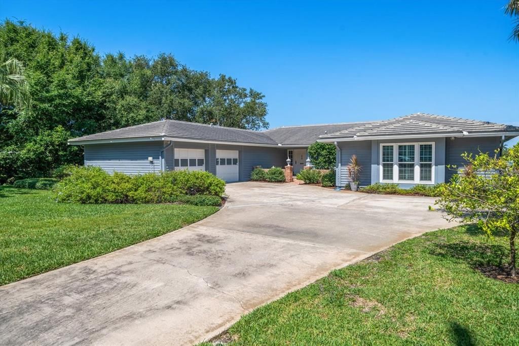 Spacious driveway with side load garage.