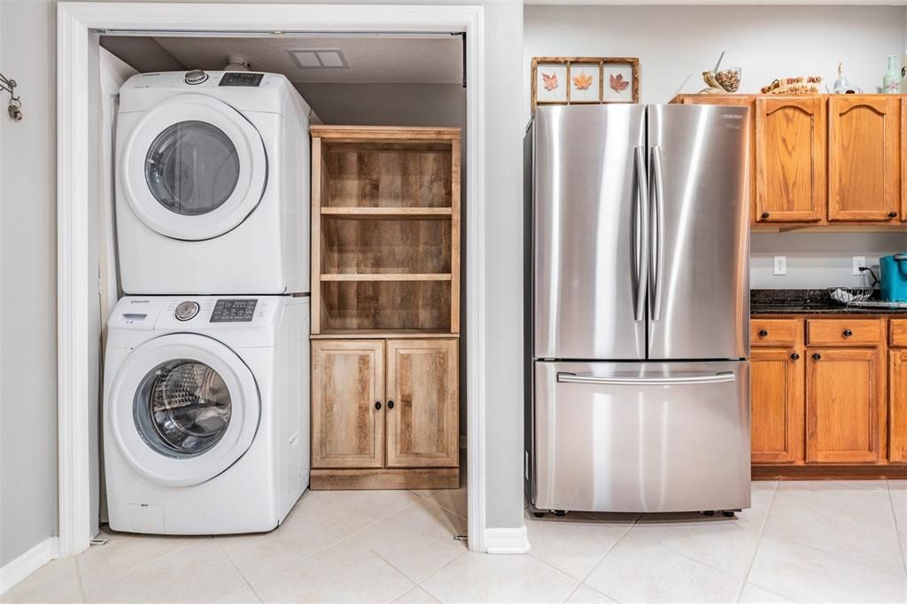 Laundry room in the kitchen, stainless steel appliances.