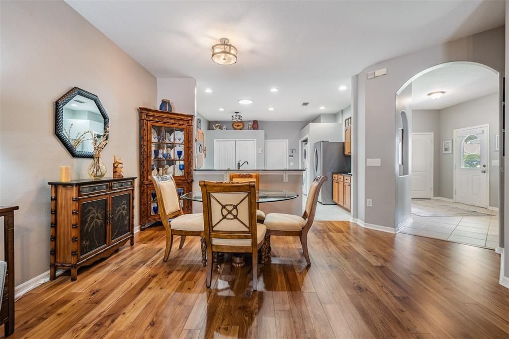 Dining Room open to the kitchen and great room, updated flooring and lighting.