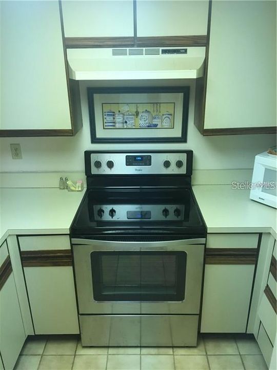 Kitchen with Stainless Steel Stove.