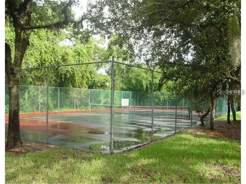 Tennis court is on Sunset Shores property.