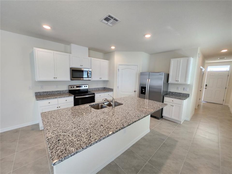 Kitchen, Island and Stainless Steel Appliances