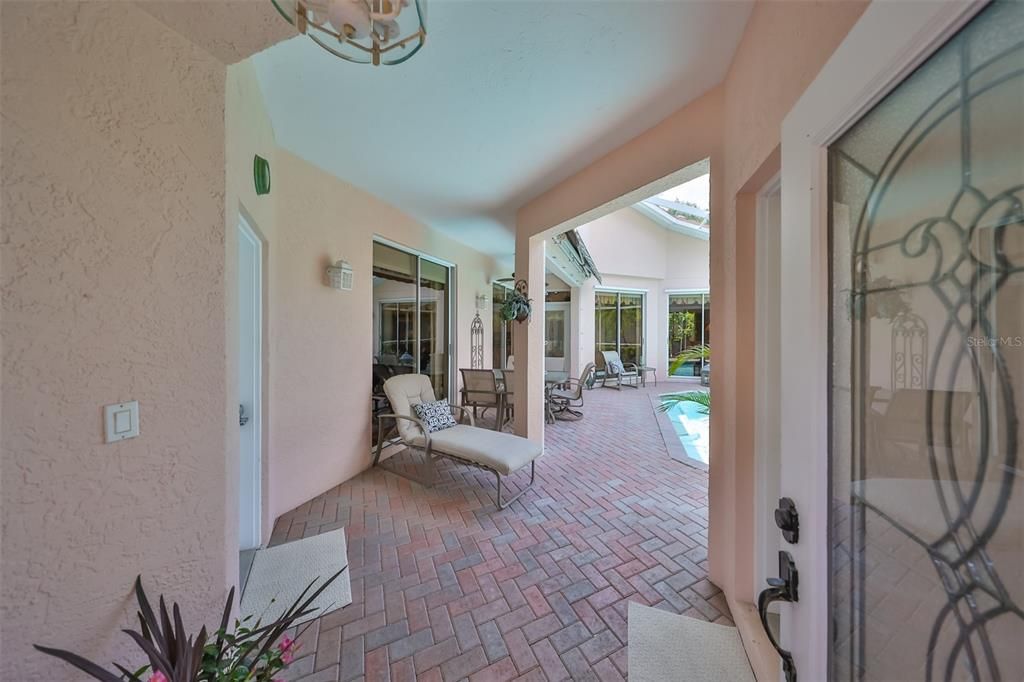 Front door opens into the pool patio area