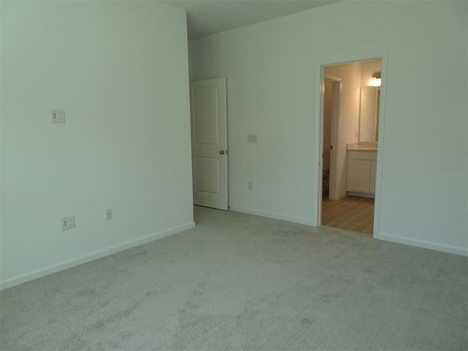 INSIDE PRIMARY BEDROOM TOWARD BATHROOM