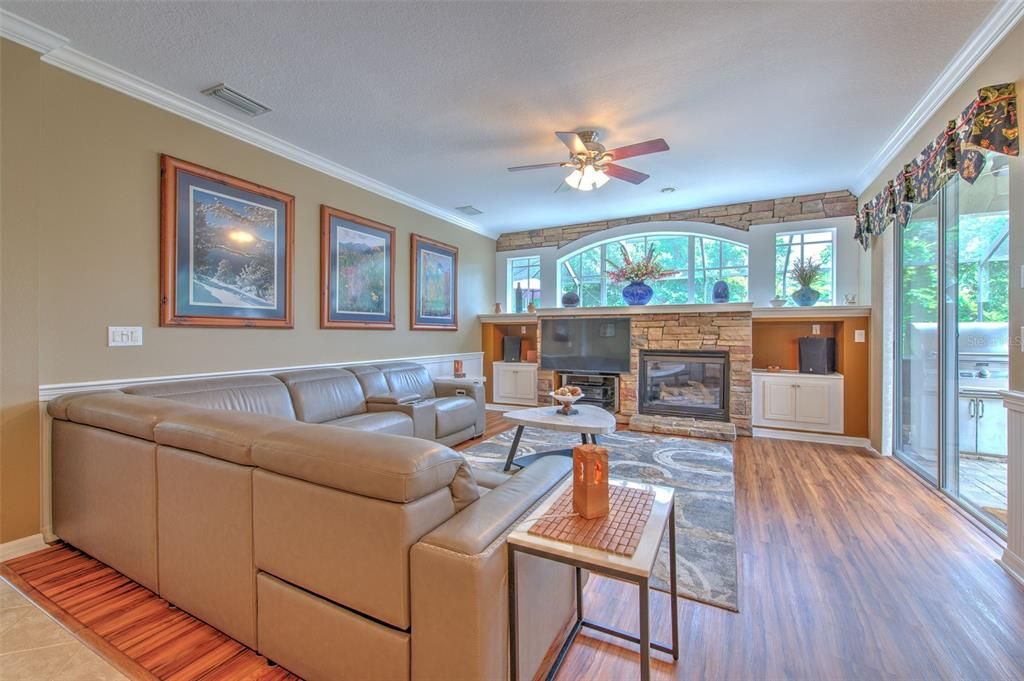 Family Room with Fireplace, Stacked Stone & Built-in Cabinets.