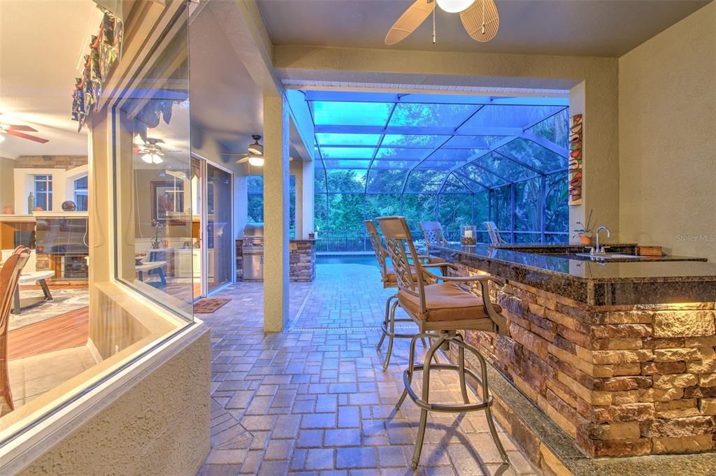 Outdoor Wet Bar and Kitchen.  (Stacked Stone, Granite & Underlighting.)