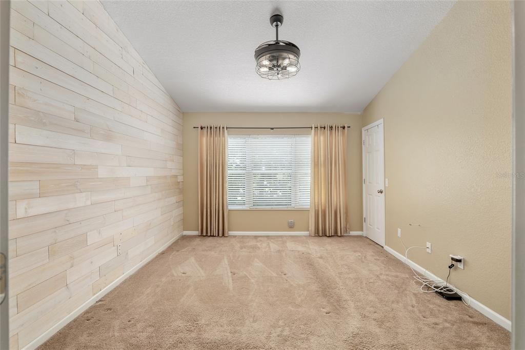 Master bedroom upstairs with shiplap wall feature