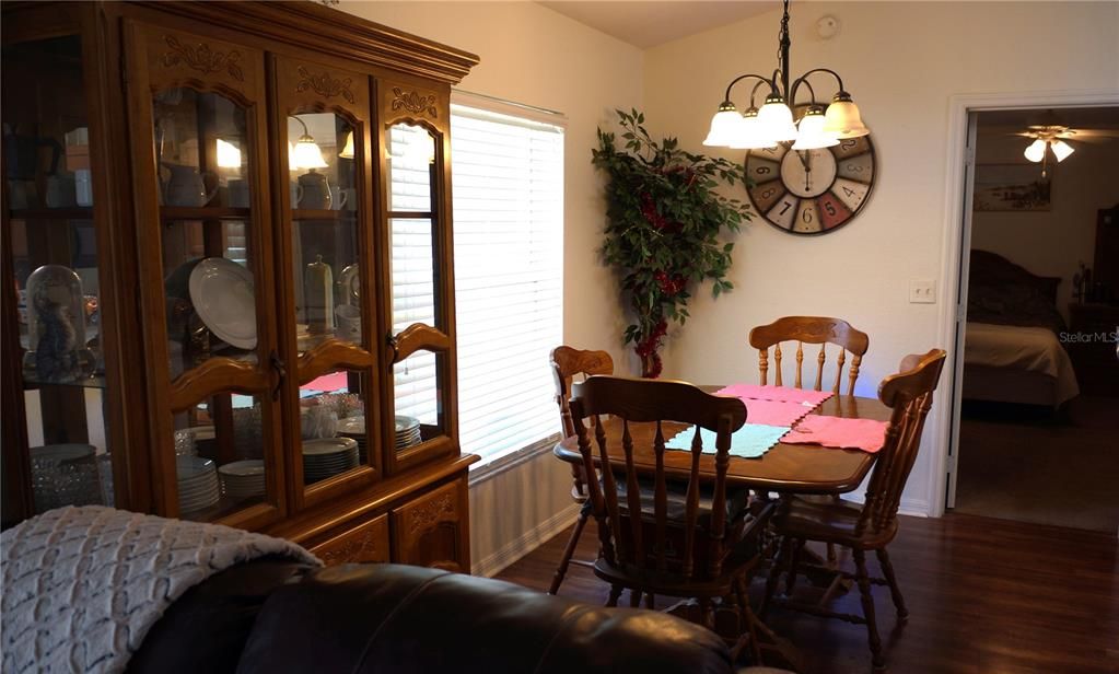 Dining room table and dishware cabinet come with home.