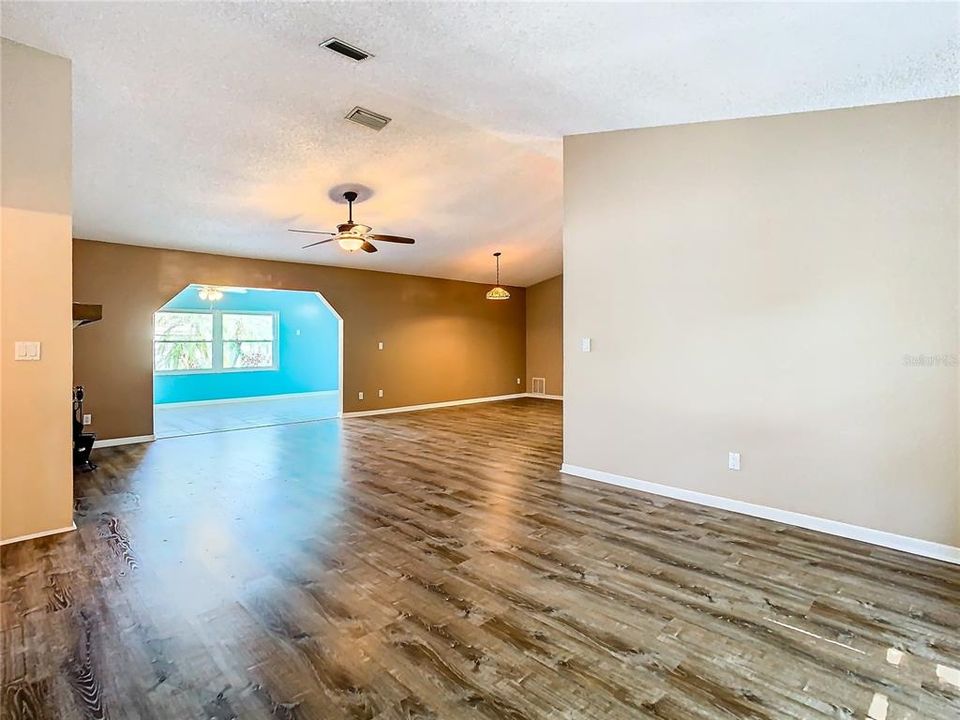 view from Florida room of dining room and loungd