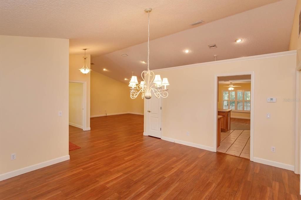 View of Formal Dining from corner of room to show access to Kitchen, Entryway and Greatroom