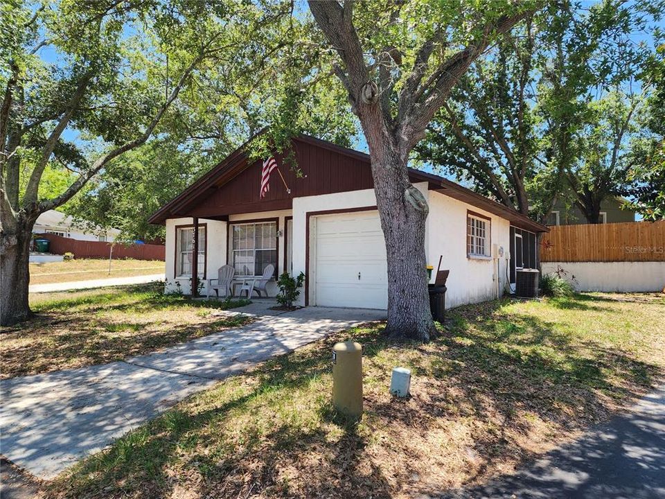 Side yard with screen patio in rear