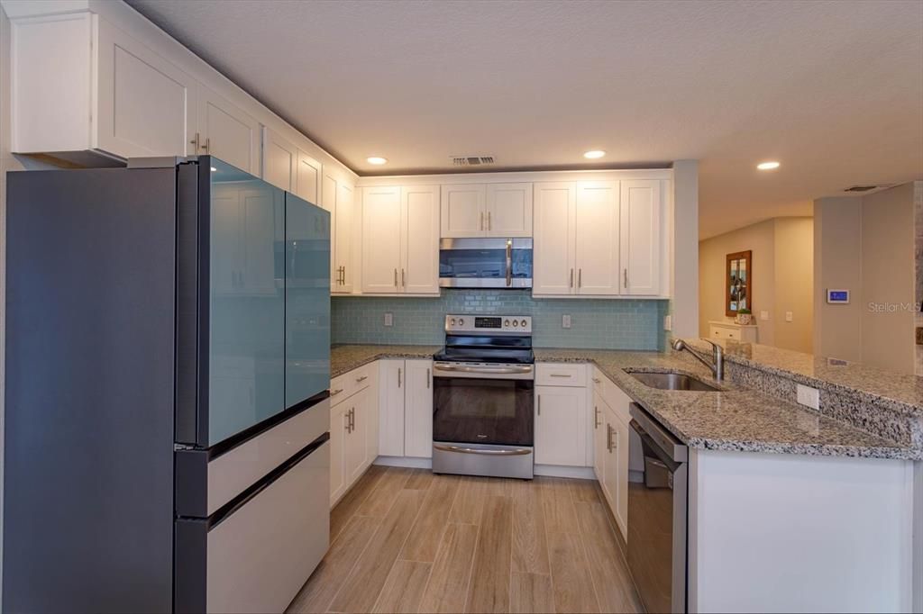 15' x 11' kitchen with granite counters and shaker cabinets