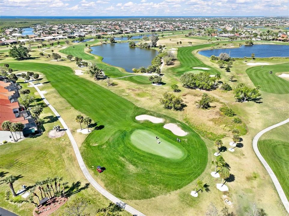 Behind the units on the golf course.  This is the 7th hole at Twin Isles.