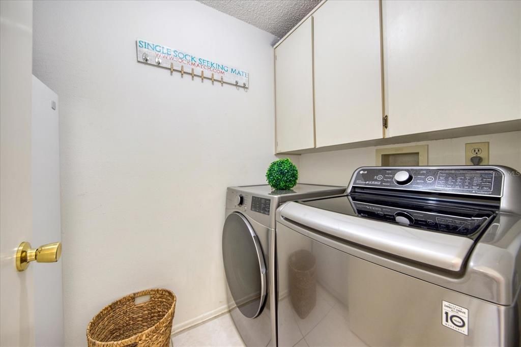 Laundry room with more cabinets inside the house~