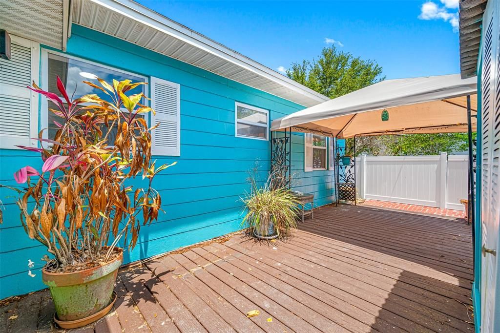 Rear Deck, patio, and garden area in the fenced back yard.