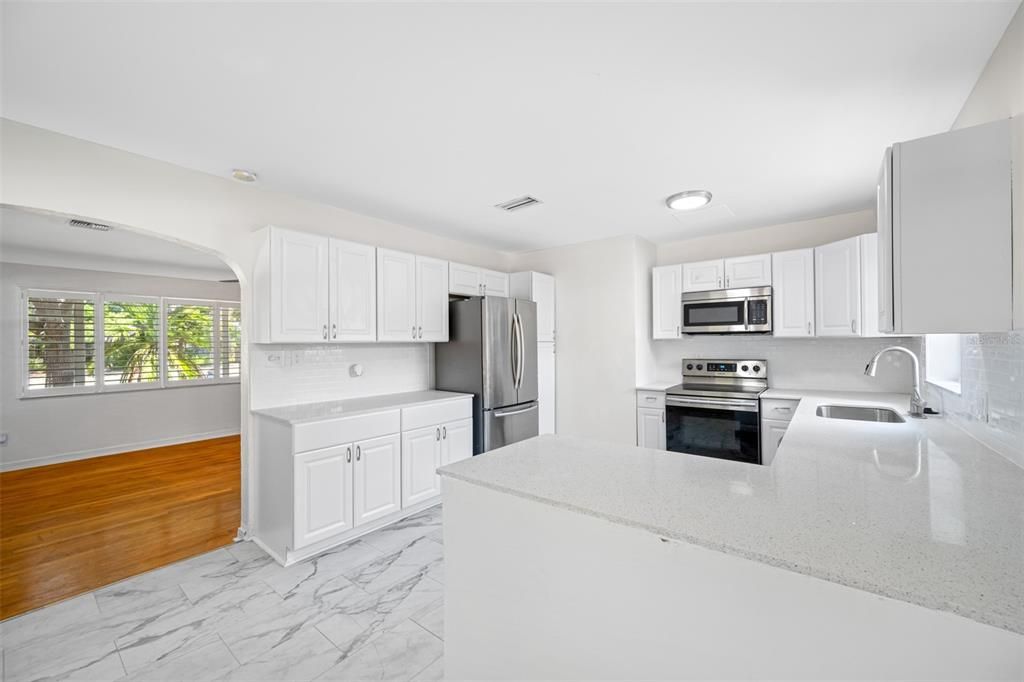 Updated Kitchen with shaker cabinets, granite counters, new stainless-steel appliances.