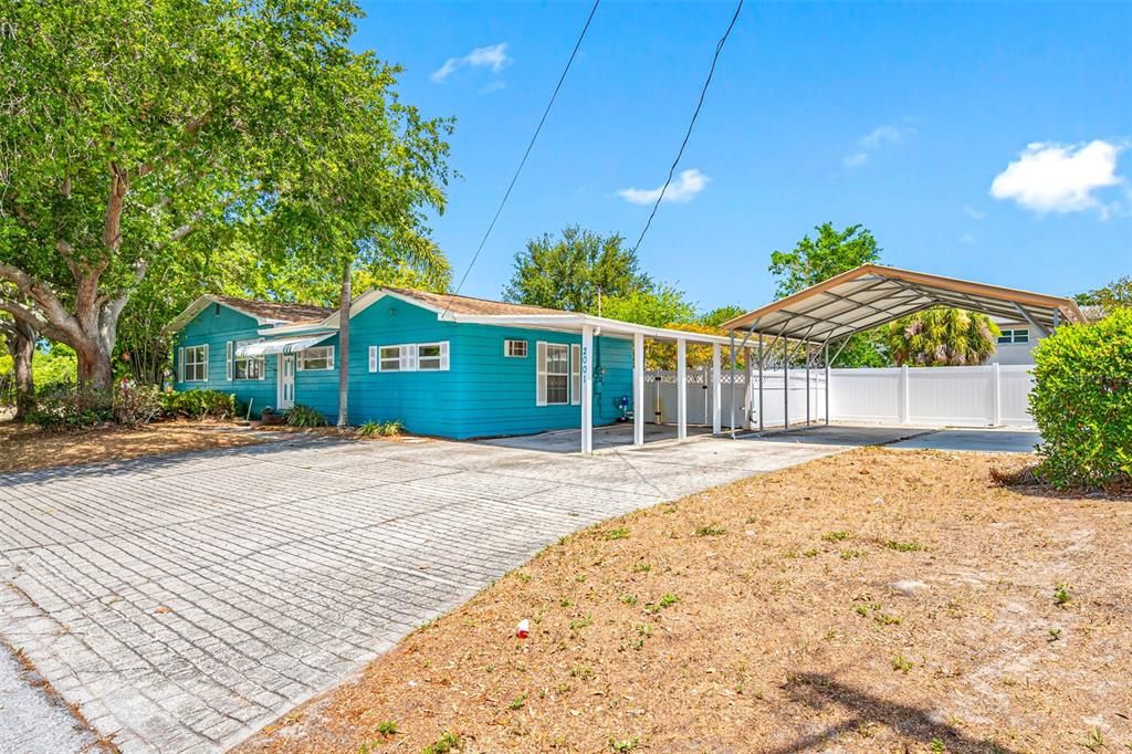 Carport and covered parking for 2 more cars, or an RV