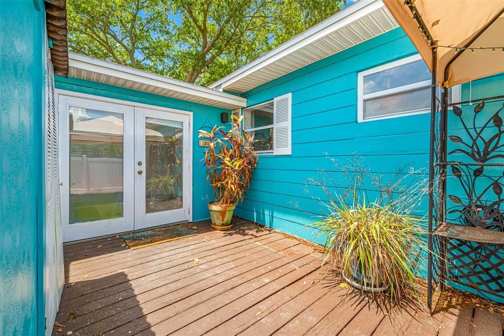 Rear Deck, patio, and garden area in the fenced back yard.