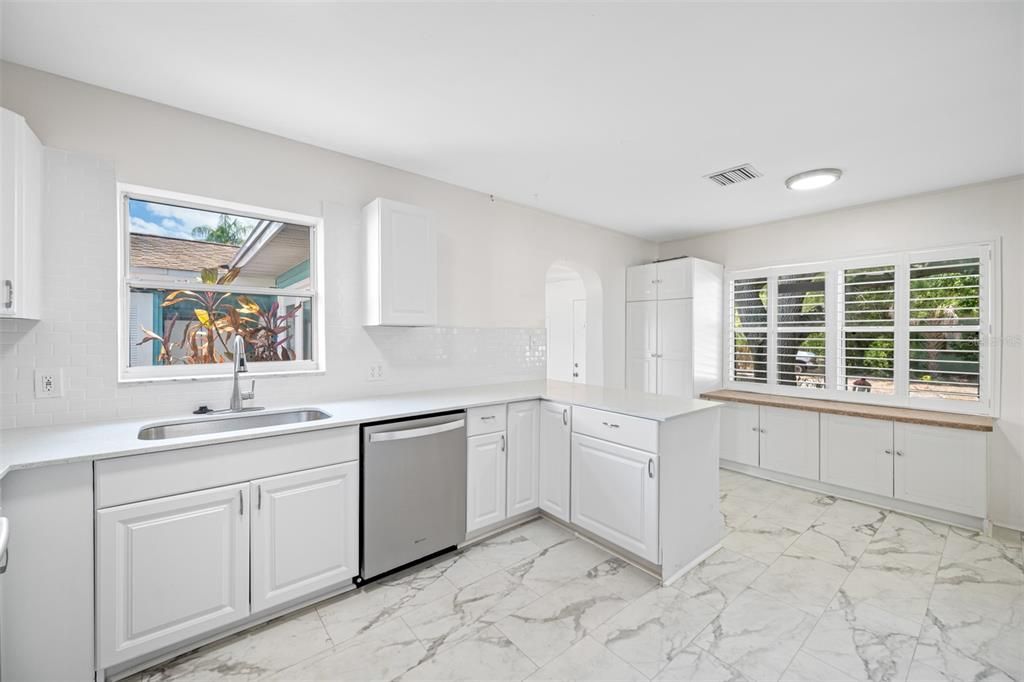 Updated Kitchen with shaker cabinets, granite counters, new stainless-steel appliances.