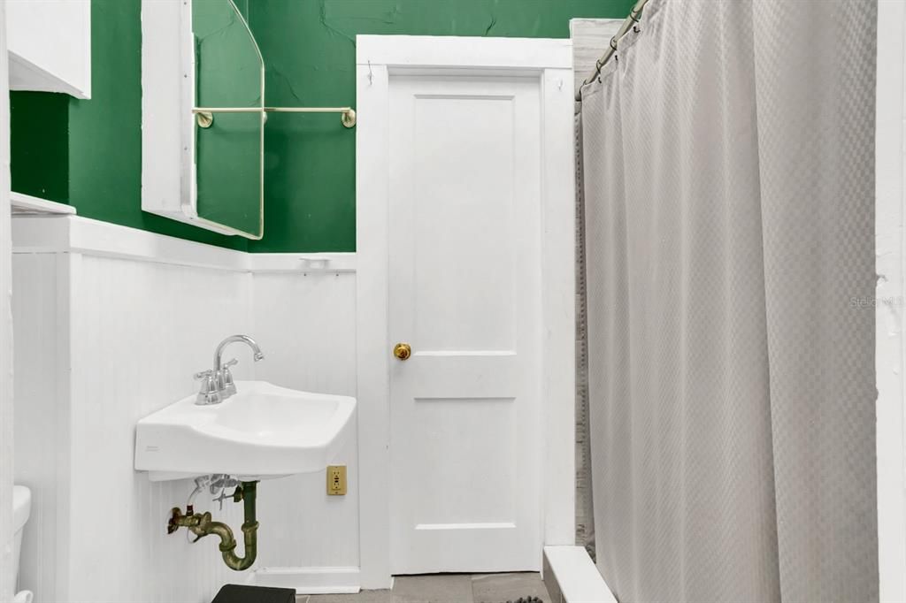 Downstairs jack and jill bathroom between primary and bedroom 2