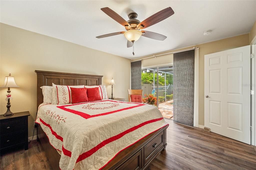 Primary Bedroom With Sliders To Lanai