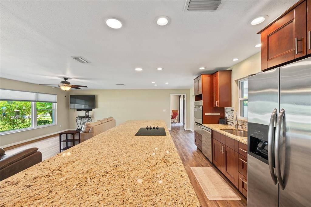 Granite Counter Makes A Wonderful Serving Area For Entertaining