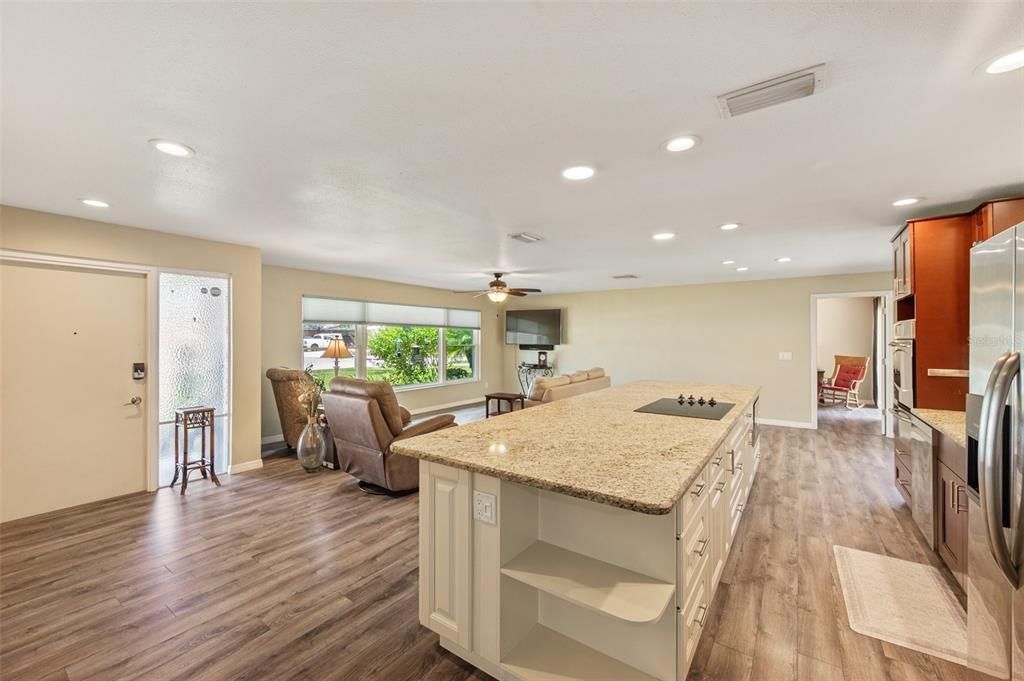 Abundant Storage On Both Sides Of Granite Counter Top Island