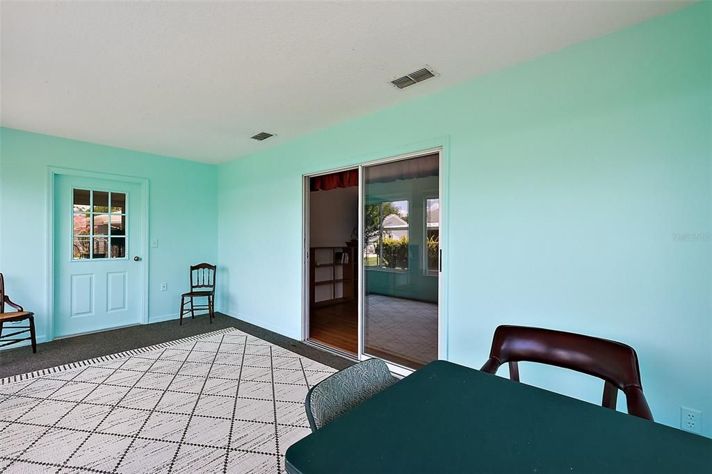 Looking across sunroom showing entrance to lanai and house