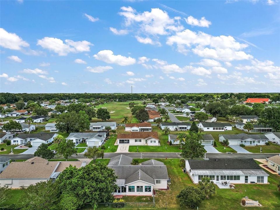 Aerial shot showing the back of the property and the surrounding neighborhood